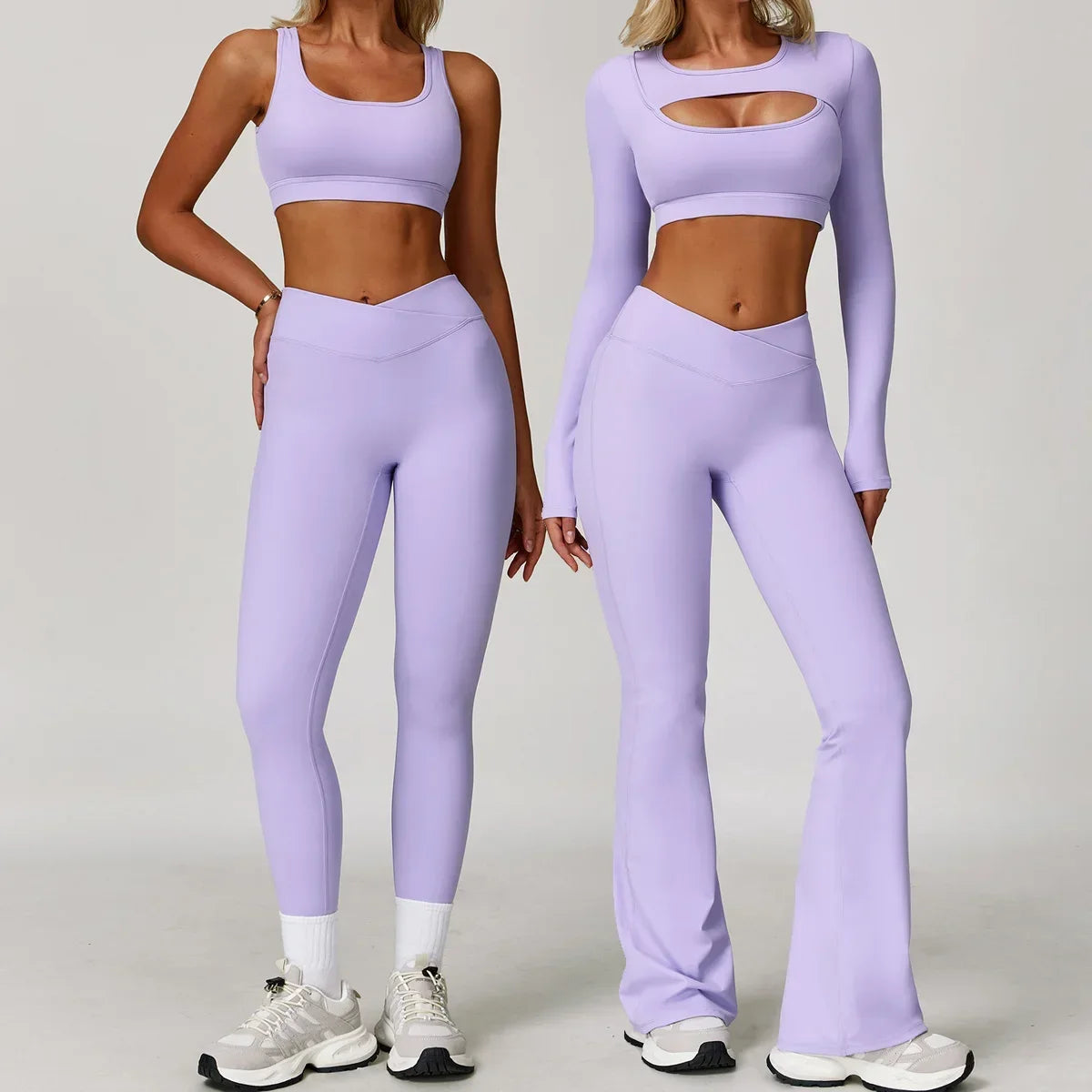 Two women wearing matching lavender athletic outfits on a plain background