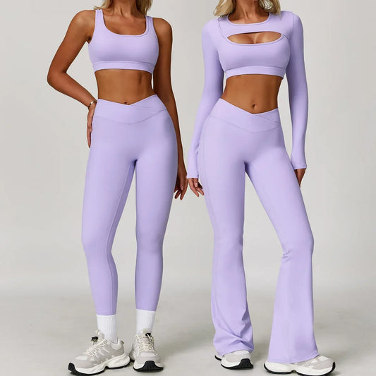 Two women wearing matching lavender athletic outfits on a plain background