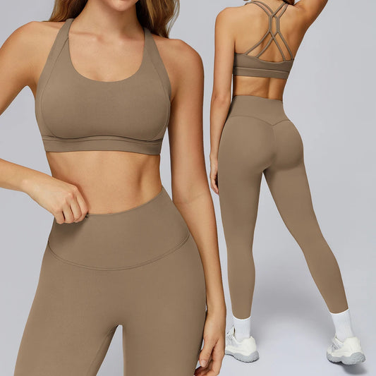 Brown sports bra and leggings set on a gray background