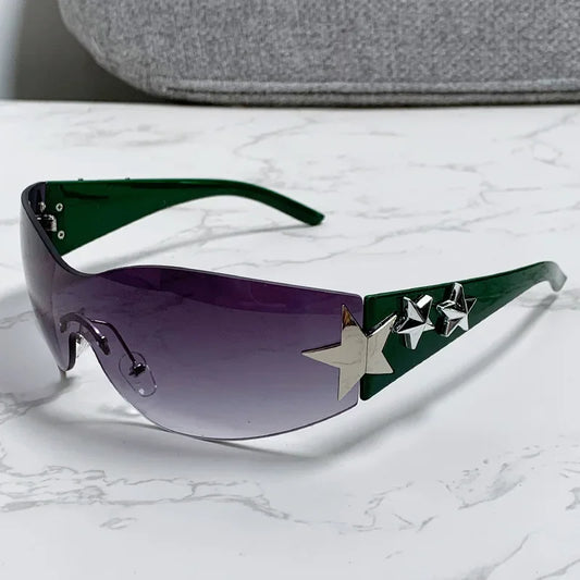 Sunglasses with star designs on a marble surface