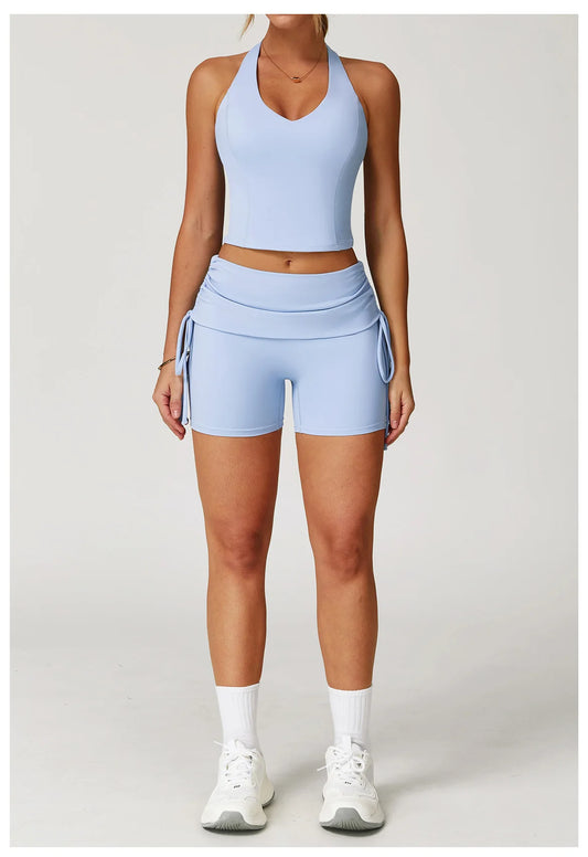 Person wearing a light blue athletic outfit on a white background